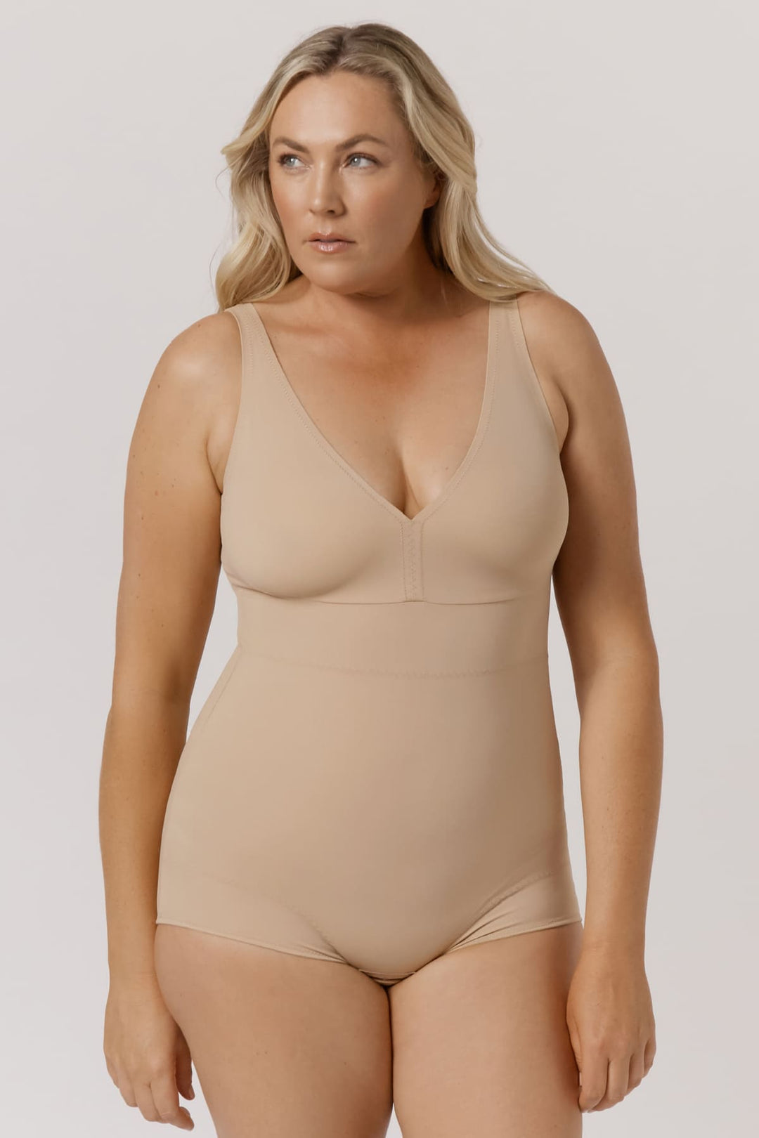 Curve Control Bodysuit I Woman wearing shaping bodysuit model I Bella Bodies I Taupe